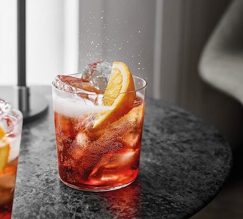 A picture of a Negroni Cocktail resting on a table as featured in ThatCocktails What is Campari article.