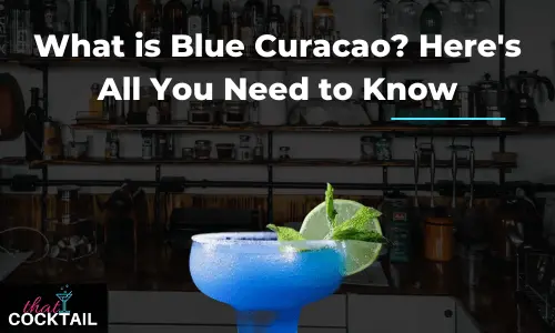 Blue curacao cocktail garnished with lime and mint