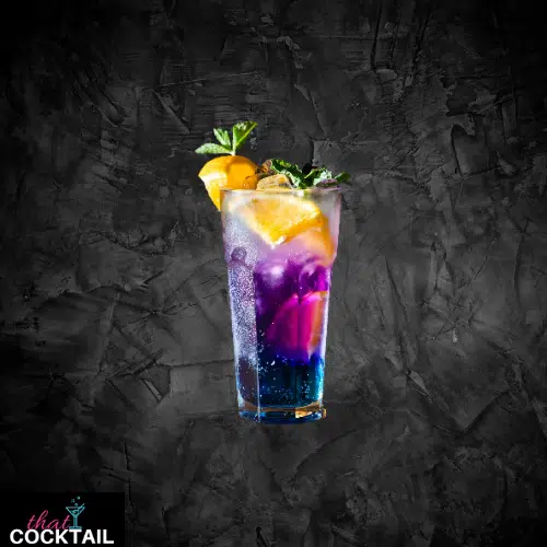 Cheeky Vimto in a tall glass, layered purple and blue with fruit