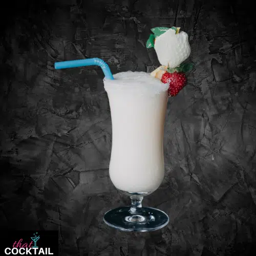 Pina Colada in a hurricane glass, creamy white with a straw and fruit