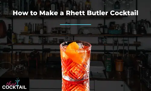 Rhett Butler Cocktail in a cut-glass tumbler with orange