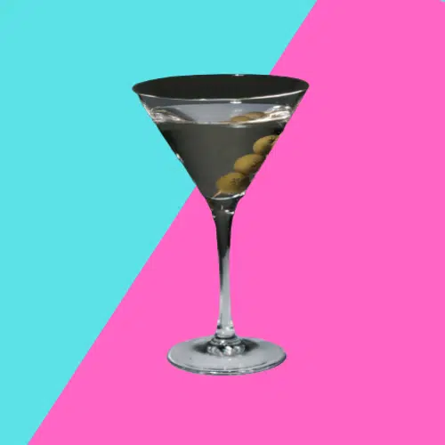 Dry Martini in a martini glass with green olives on a pick