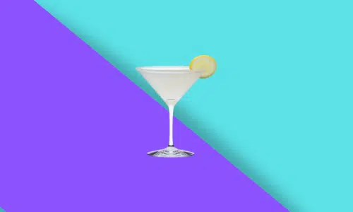 Sandpaper in a martini glass with a citrus wheel