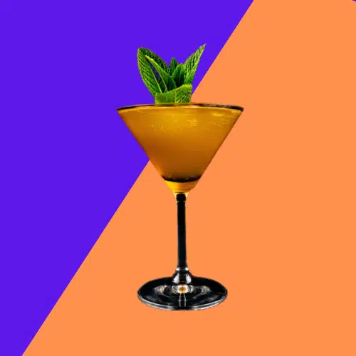 Golden Navel Razz in a martini glass with a mint sprig