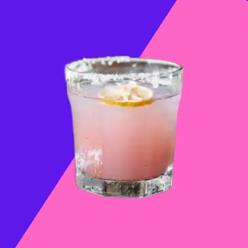 Paloma in a salt-rimmed tumbler with a lemon slice