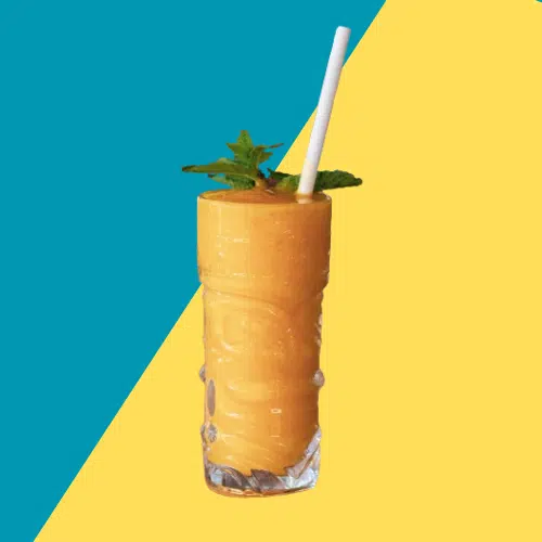Russian Suntan in a tall tiki glass with mint and a straw