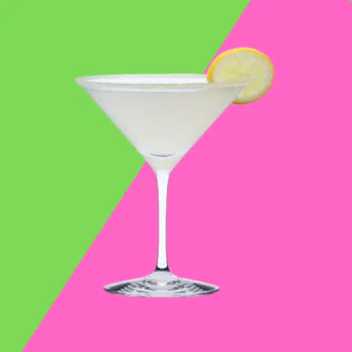 Pale Aviation cocktail in a martini glass with a citrus wheel