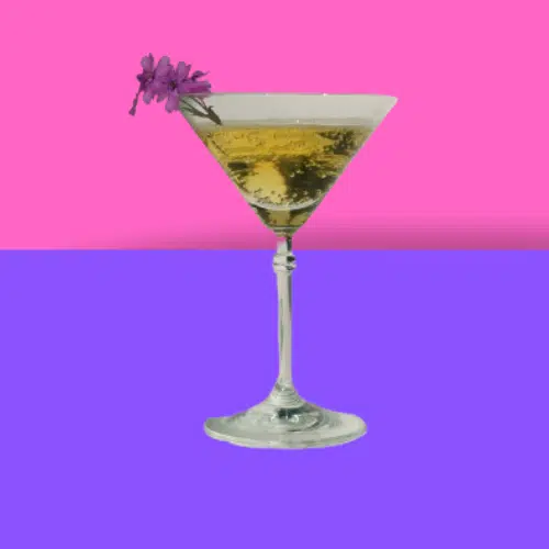 Tropical Peach Soda in a martini glass with a flower garnish