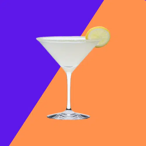 Bee’s Knees in a martini glass with a lime wheel