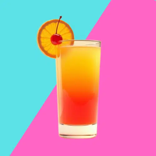 Jamaican Sunrise fading from orange to red in a tall glass with an orange wheel and a cherry