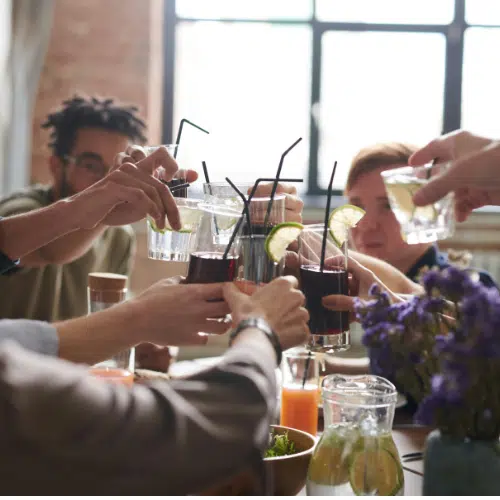 Friends toasting with non-alcoholic drinks